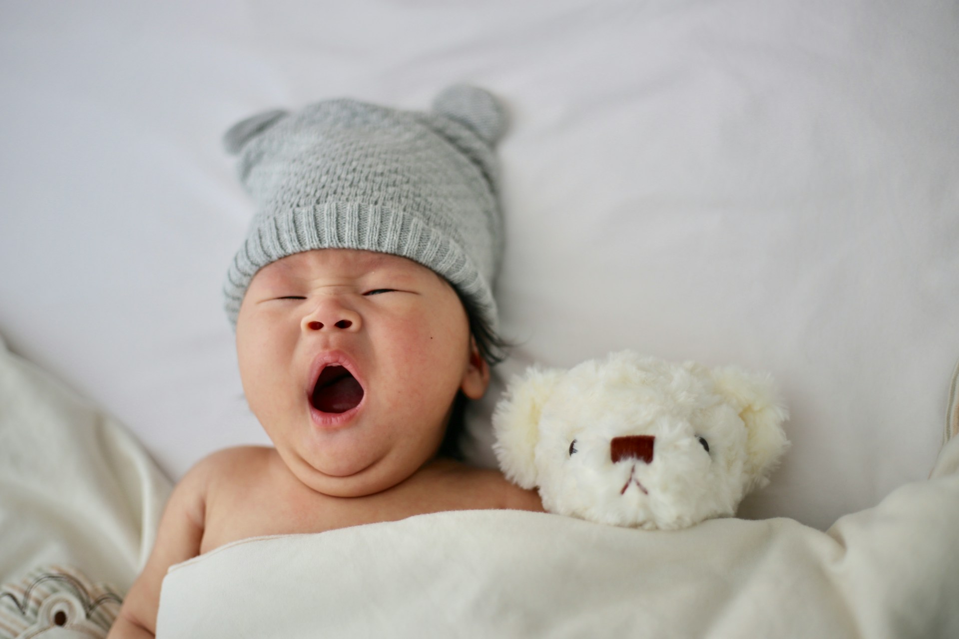 a newborn baby yawning