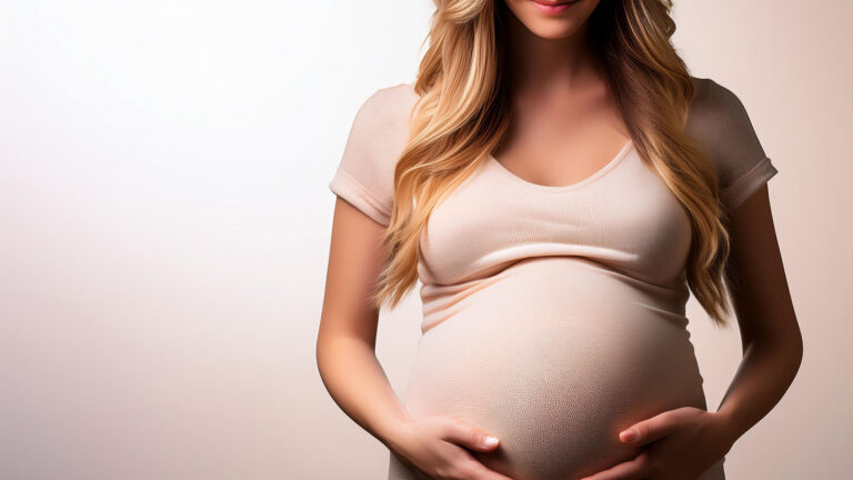 pregnant woman holding her stomach